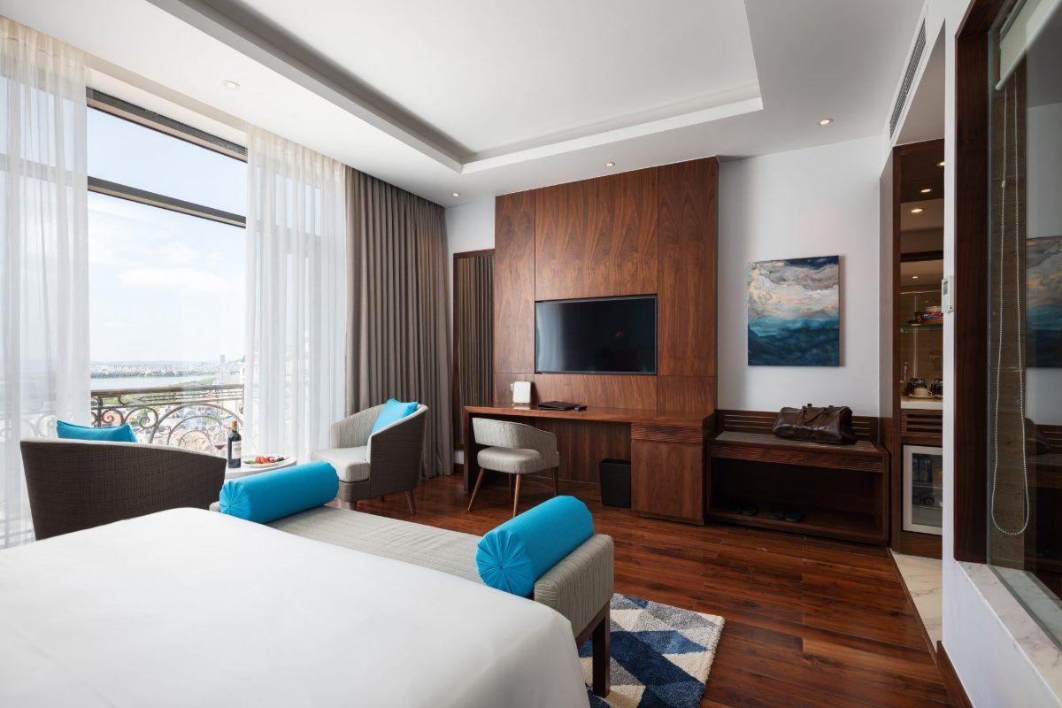 Smart TV and desk in a room at D'Lecia Ha Long