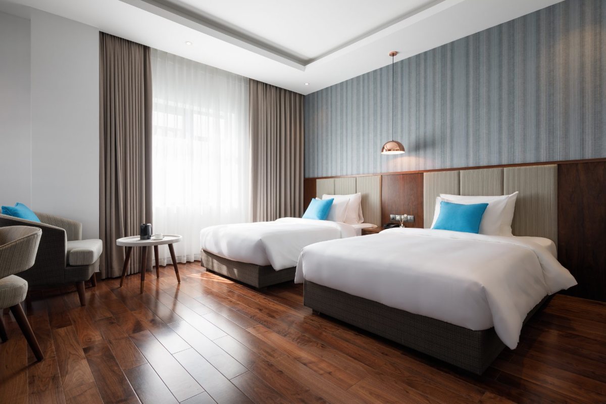 Two single beds in the Superior Twin room at D'Lecia Ha Long