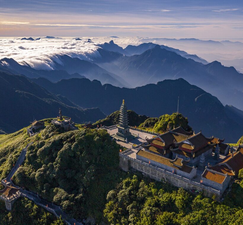 Pagodas and stupa on the Fansipan summit above a sea of clouds, Sapa, Vietnam