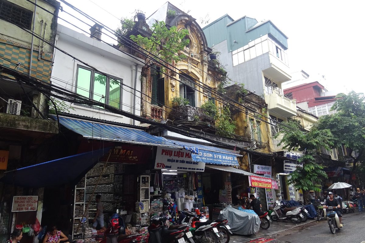 Shophouses and motorbikes on Hang Bo Street in Hanoi Old Quarter