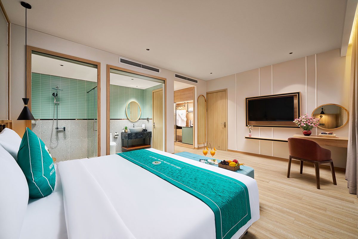 Deluxe room with large window at Heritage Charm Hotel Trang An