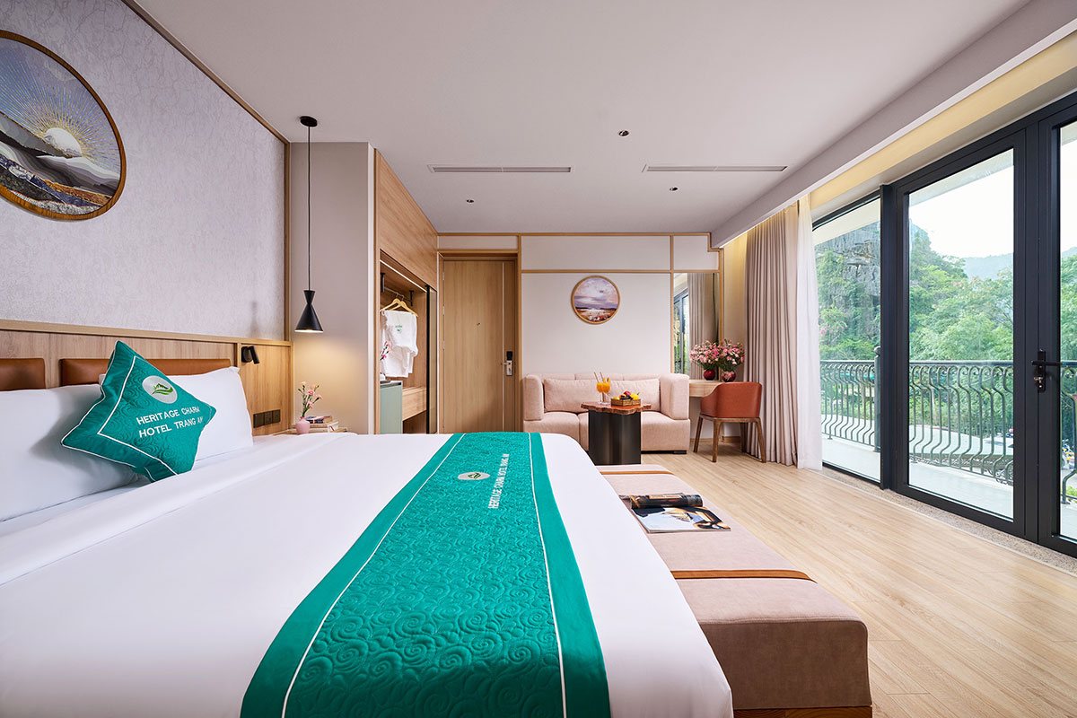 Sofa lounge in the Junior Suite at Heritage Charm Hotel Trang An