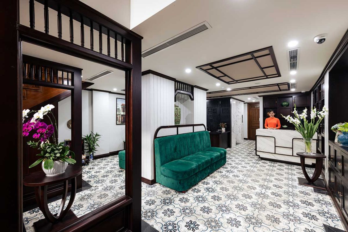 Lobby with green sofa at Lotusama Hanoi Hotel