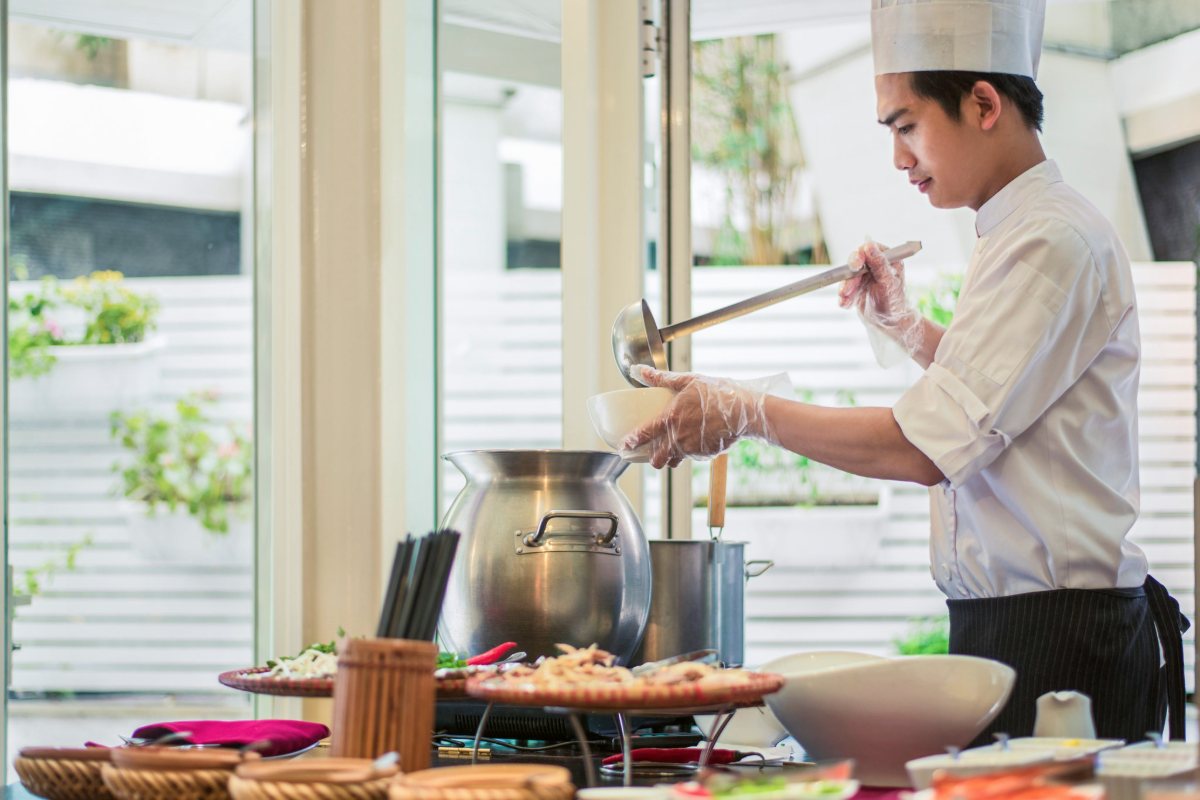 Chef preparing pho at Mercure Hanoi La Gare