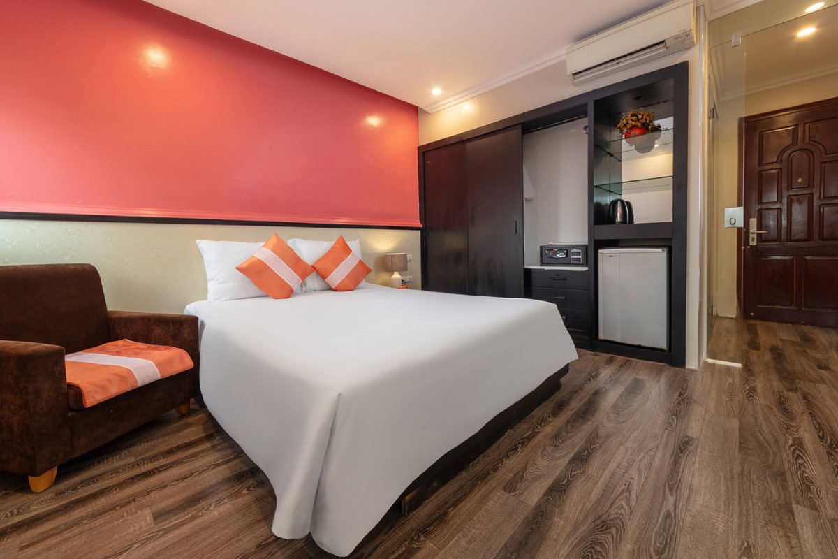 Deluxe room with sofa at Omina Hanoi Hotel