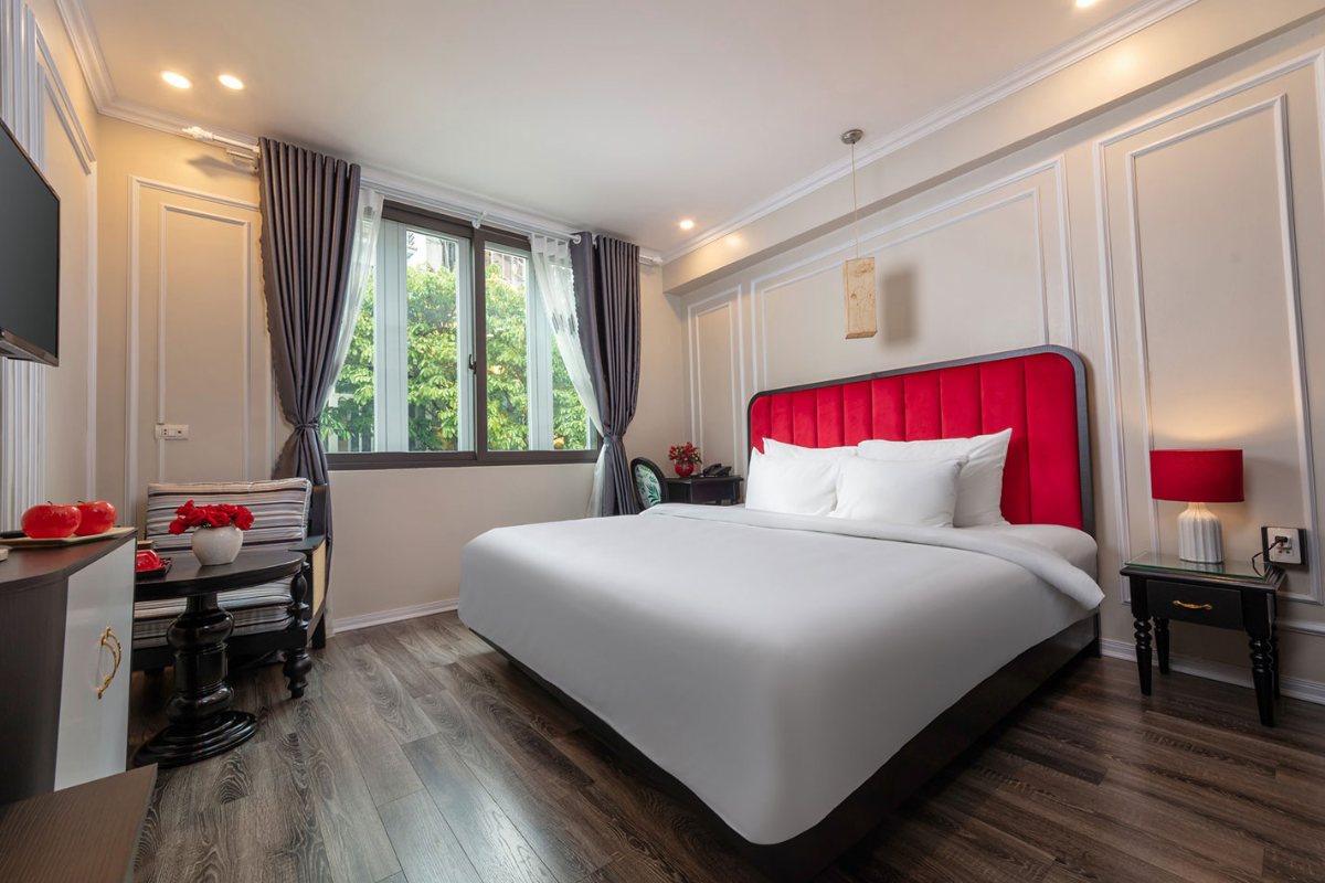 King bed in the Deluxe Suite at Omina Hanoi Hotel