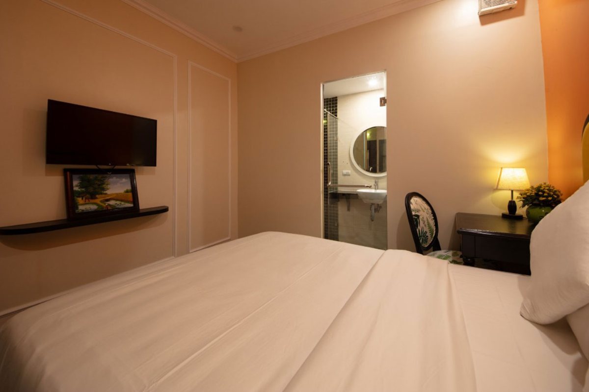 Bed in the Small Double Room at Omina Hanoi Hotel