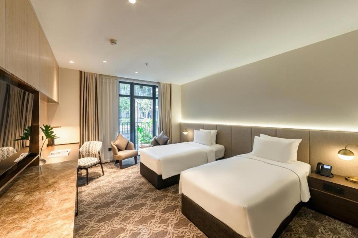 Deluxe Twin Room interior at REY Hotel Hanoi