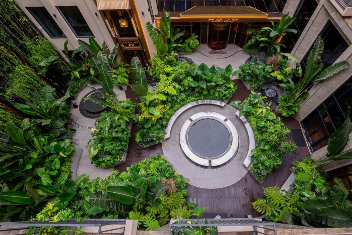 Green garden courtyard at REY Hotel Hanoi