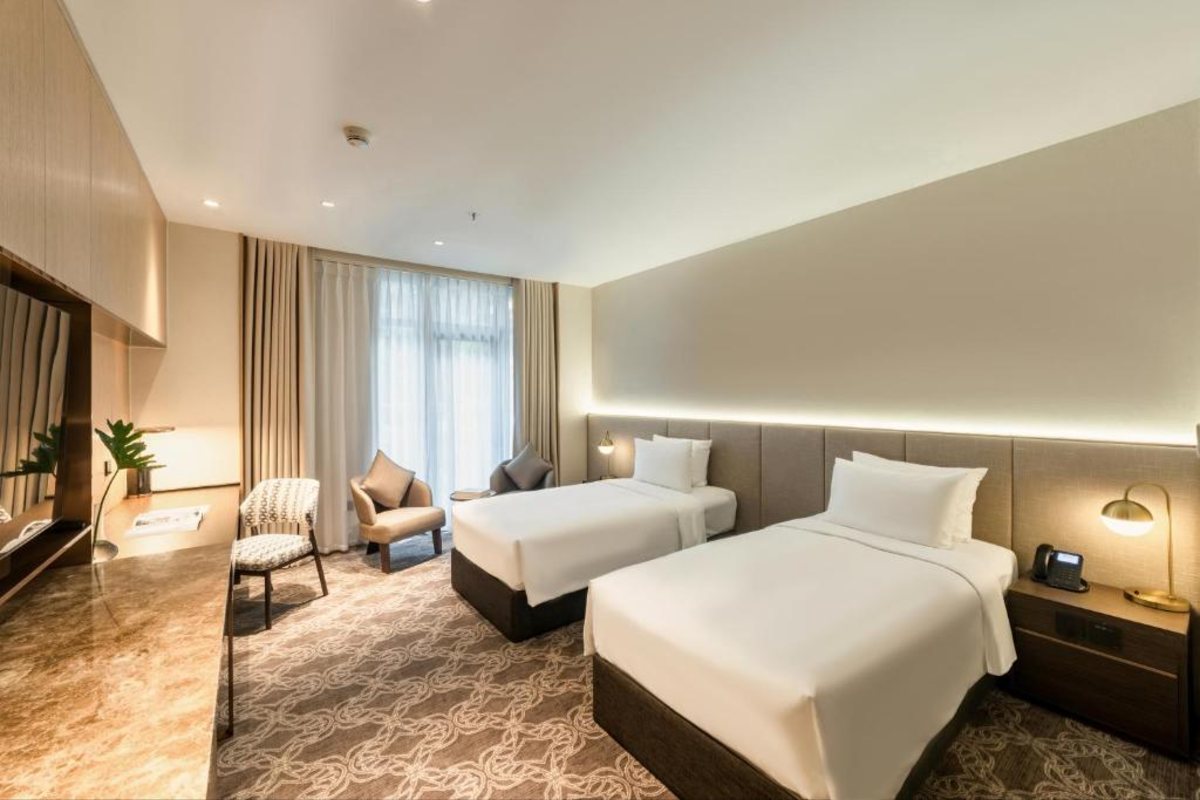 Twin beds at REY Hotel Hanoi