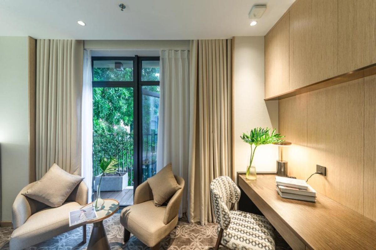 Sitting area in the Superior King Room at REY Hotel Hanoi