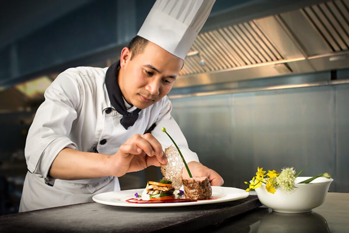 Chef at work in the kitchen of Silk Path Boutique Hanoi