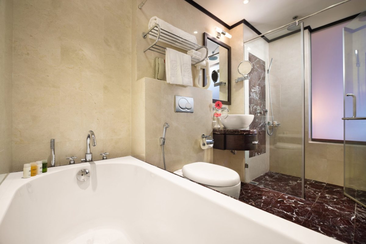 Triple room bathroom with bathtub at Silk Path Hotel Hanoi