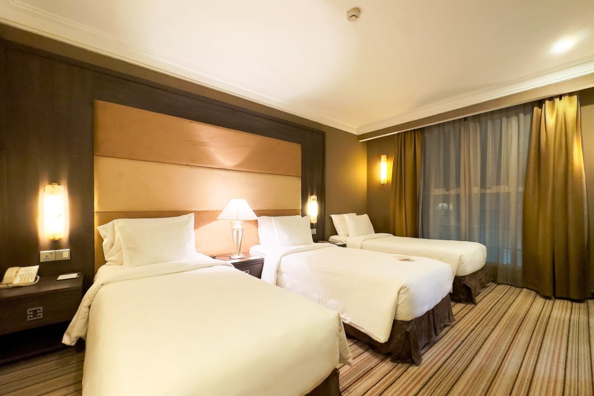 Triple room interior at Silk Path Hotel Hanoi