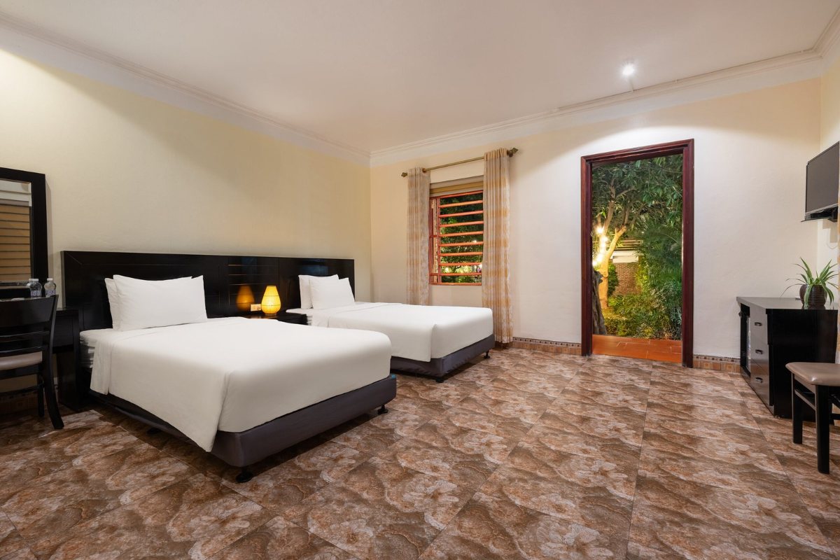 Beds in a family room at Trang An Heritage Garden
